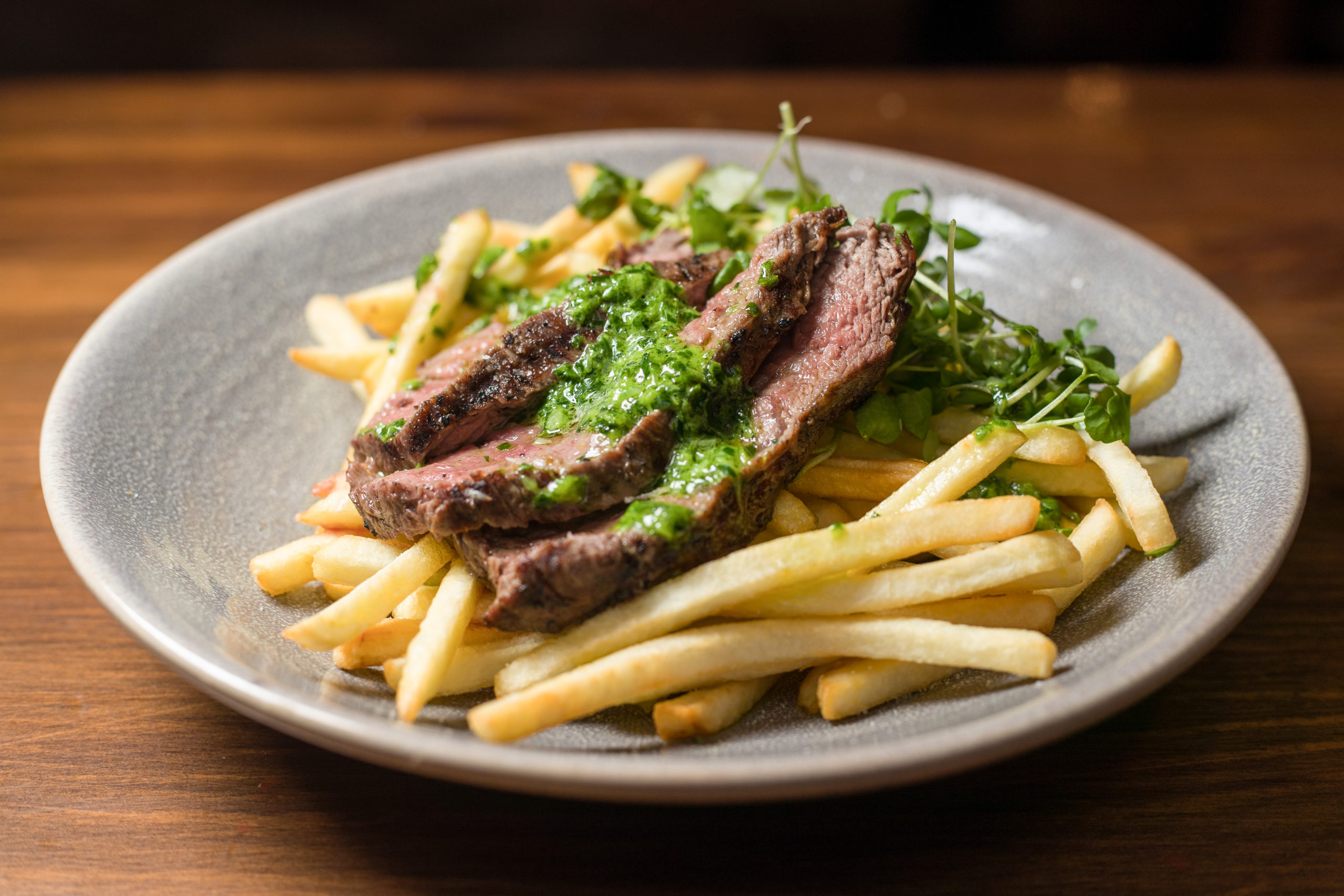 Steak and chips with salsa verde
